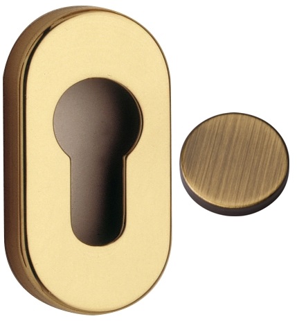 Bocchetta REGUITTI modello 009 ovale per porta interna con foro yale in ottone bronzato graffiato